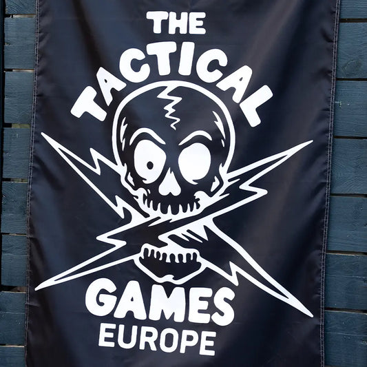 A black banner featuring a white skull and crossed lightning bolt graphic with the text 'THE TACTICAL GAMES EUROPE',
